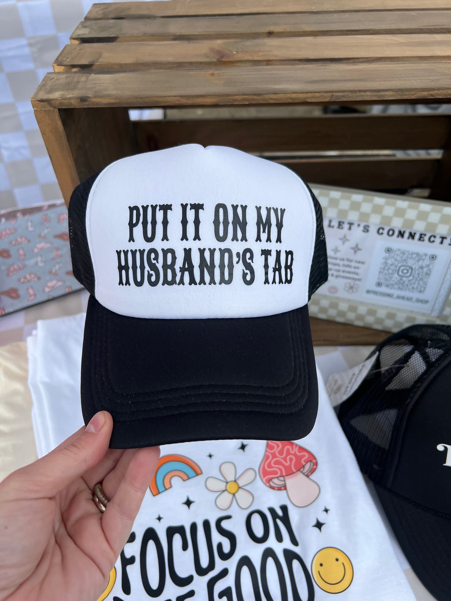 Put It On My Husband’s Tab Trucker Hat